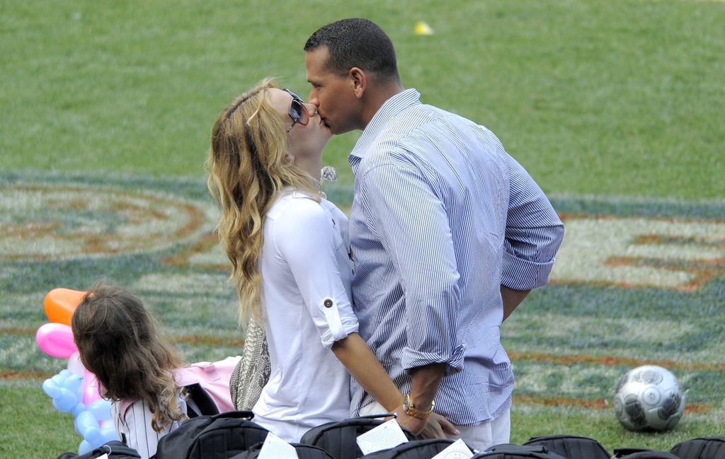 Alex Rodriguez and actress Kate Hudson kiss at Yankees Family Picnic Day July 25, 2009