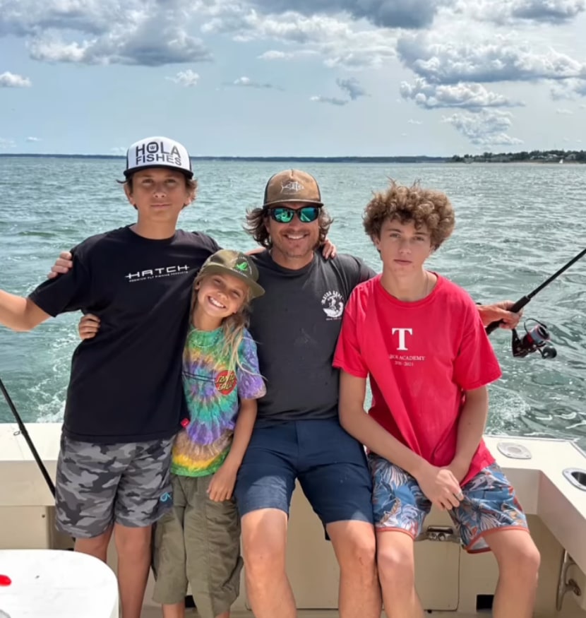Photo shared by Oliver Hudson's wife Erinn Bartlett of the actor with his kids Wilder, Bodhi, and Rio on a boat during a vacation in Cape Cod with her side of the family