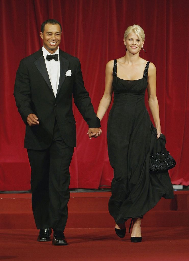 Tiger Woods and ex-wife Elin Nordegren hold hands black tie event