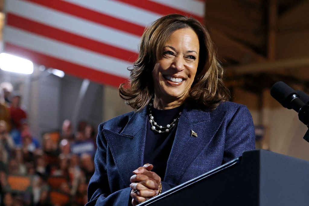 Kamala Harris smiles during a campaign rally at Michigan State University's Jenison Field House in East Lansing, Michigan