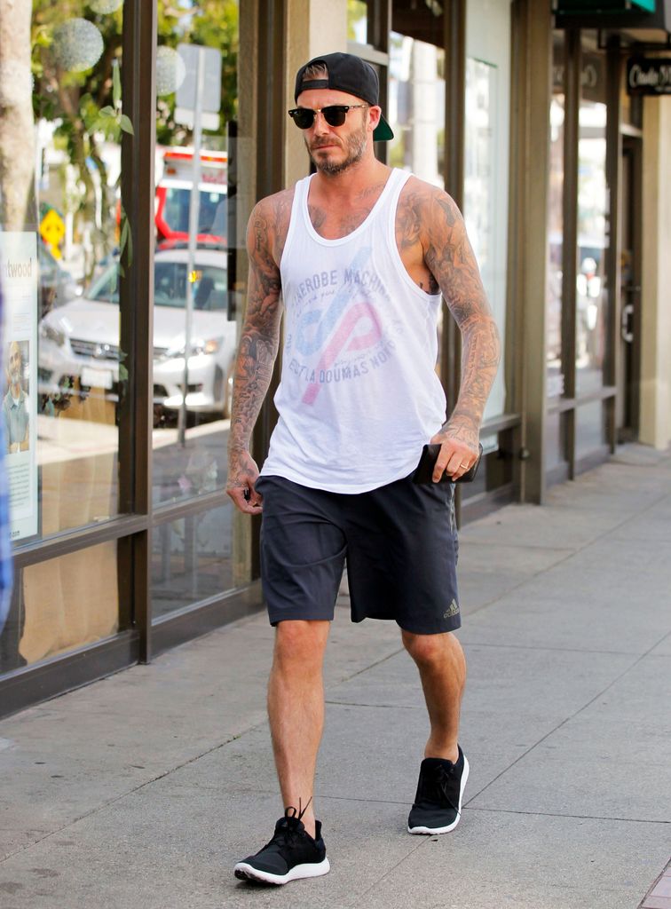 David Beckham walking with vest on