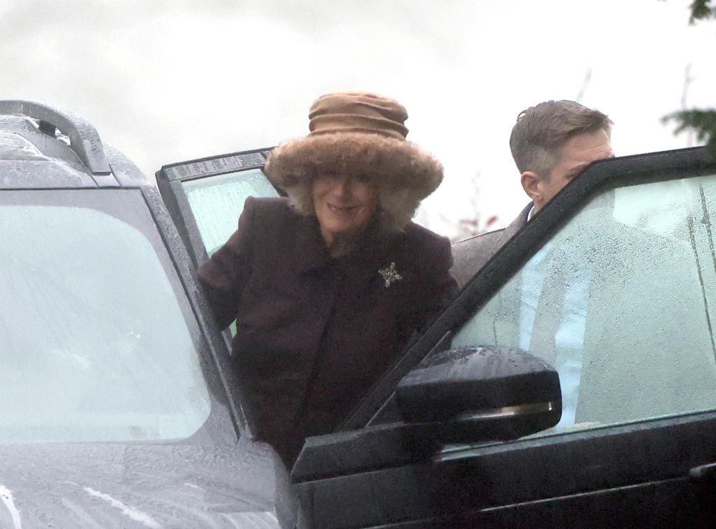 woman getting into car 