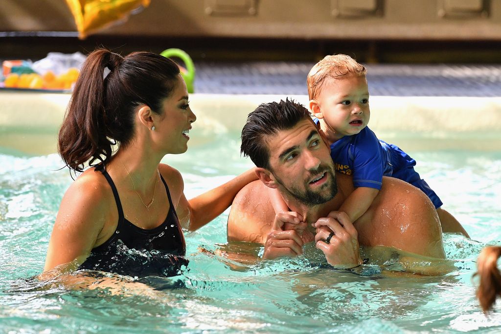 Nicole Phelps, Michael Phelps and Boomer Phelps attend the Huggies Little Swimmers
