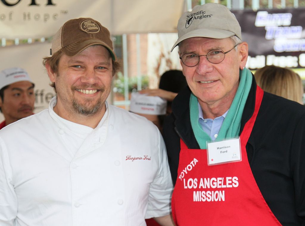 LOS ANGELES, CA - DECEMBER 24:  Chef Ben Ford (L) and father actor Harrison Ford attend the Los Angeles Mission's Christmas Eve for the homeless at the Los Angeles Mission on December 24, 2012 in Los Angeles, California.  (Photo by David Livingston/Getty Images)