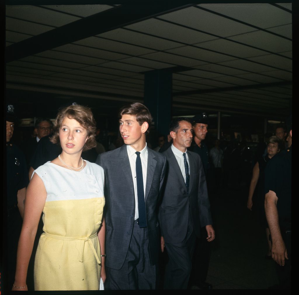 Princess Anne and Prince Charles walking and looking to the side in 1966