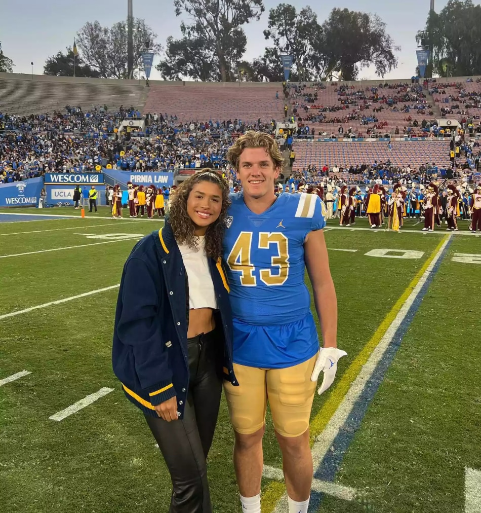 Maya Brady and her boyfriend on playing field