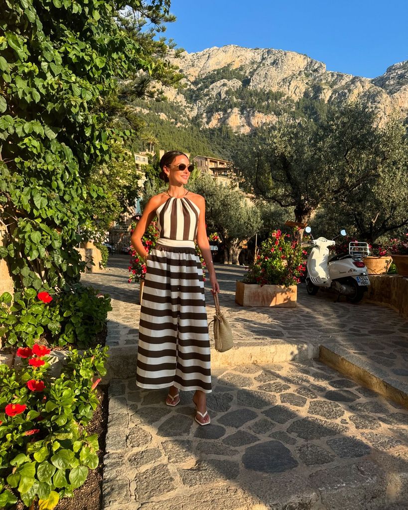 woman wearing black-and-white striped dress