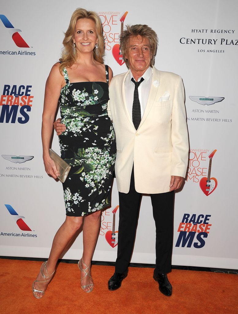 Rod Stewart and penny in florals on red carpet