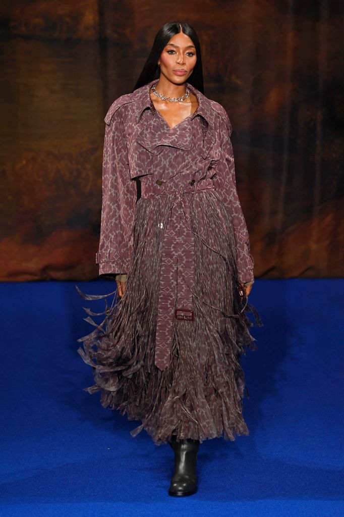 Naomi Campbell on catwalk in mauve trench coat