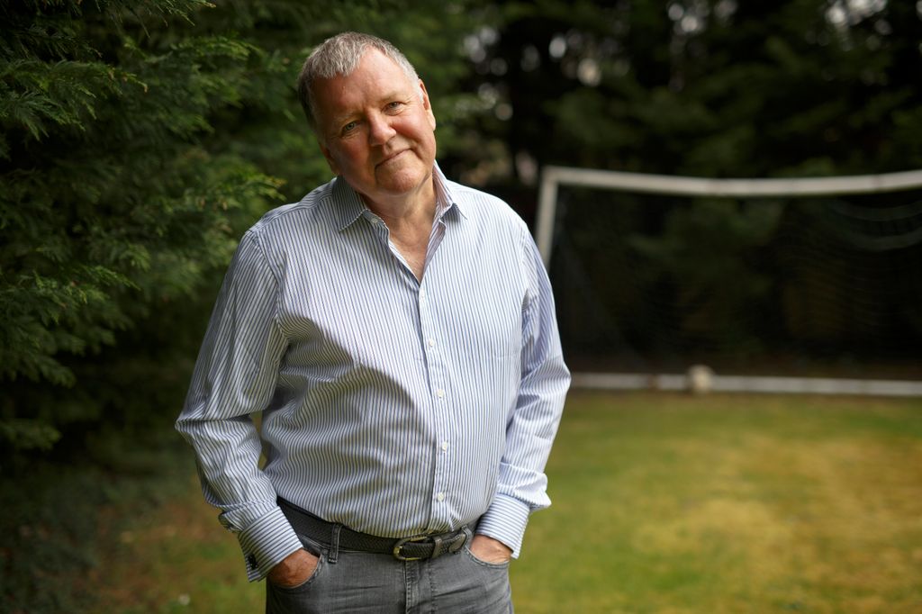 Clive Tyldesley, the football commentator, poses for a portrait in the garden of his home 