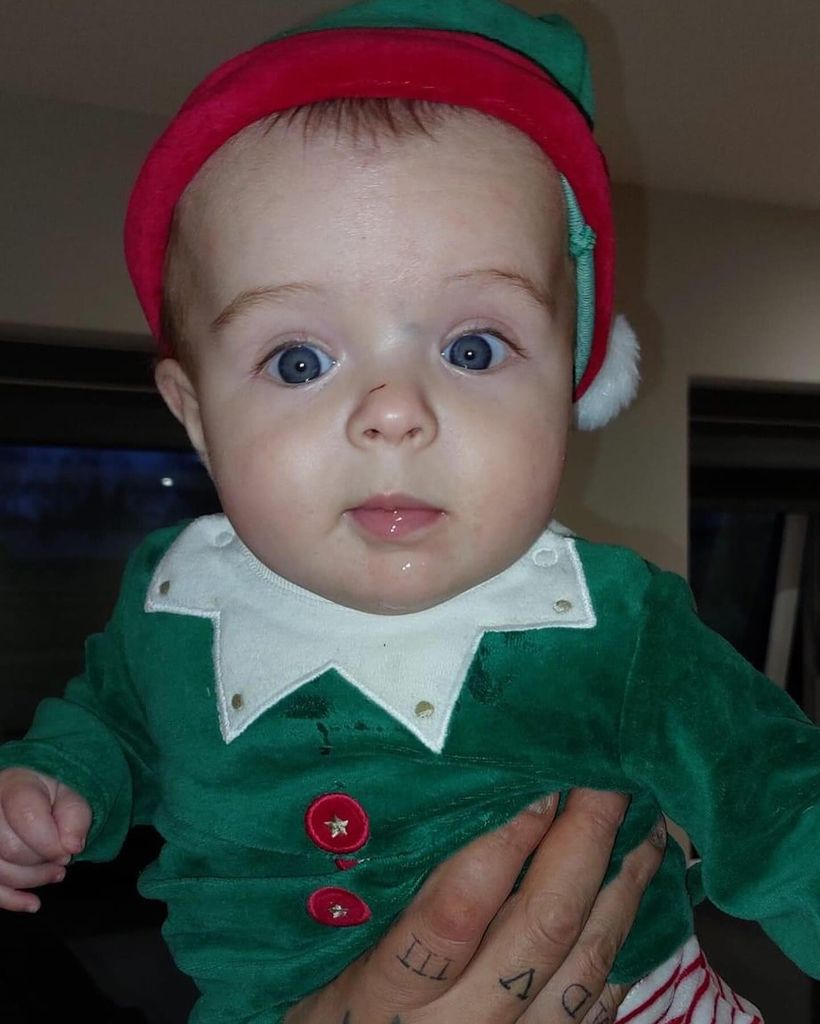 baby boy wearing elf costume 