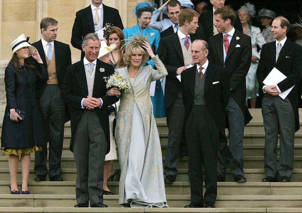 Prince Charles stands with his wife Camilla Duchess of Cornwall on the steps of St. George's Chapel in Windsor