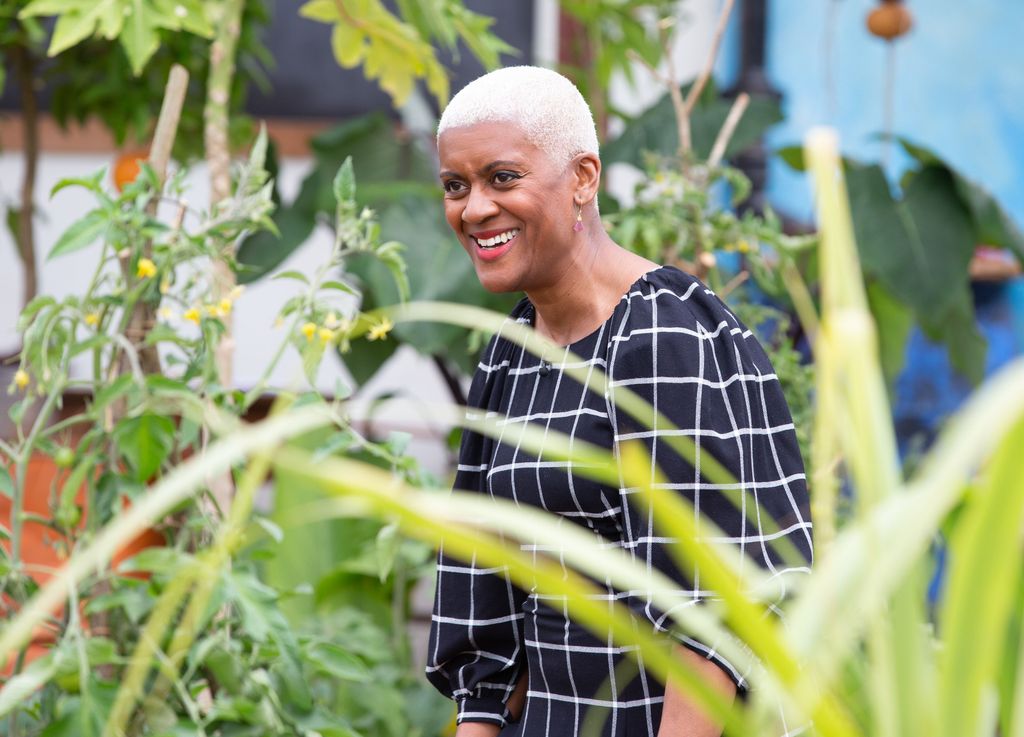 Arit Anderson surrounded by plants