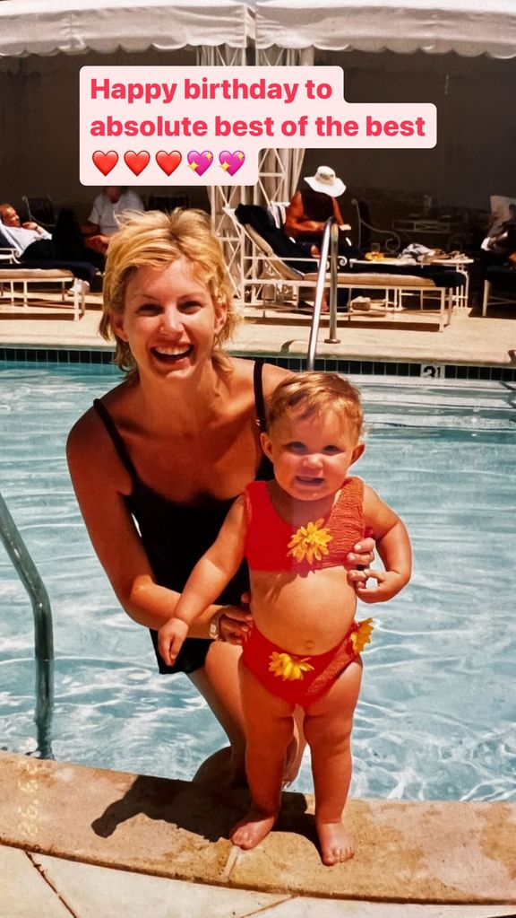  Faith Hill poses with baby girl Gracie in a pool 