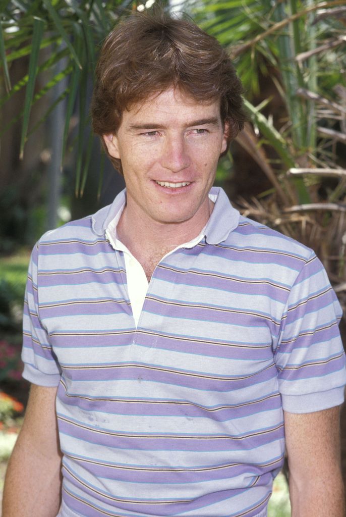 Actor Bryan Cranston on August 13, 1984 wearing a lilac striped shirt