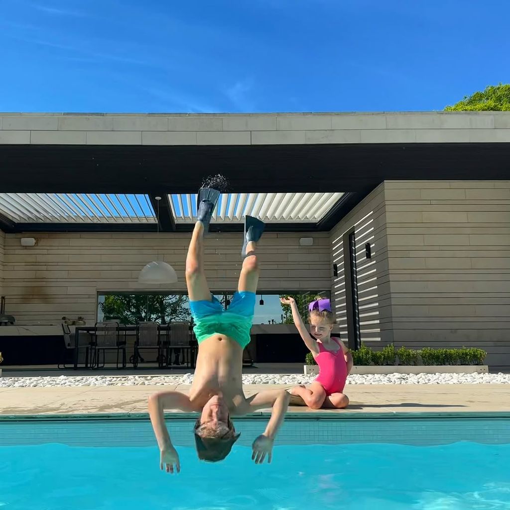 Storm and Ronan Keating's two kids playing in their pool at home