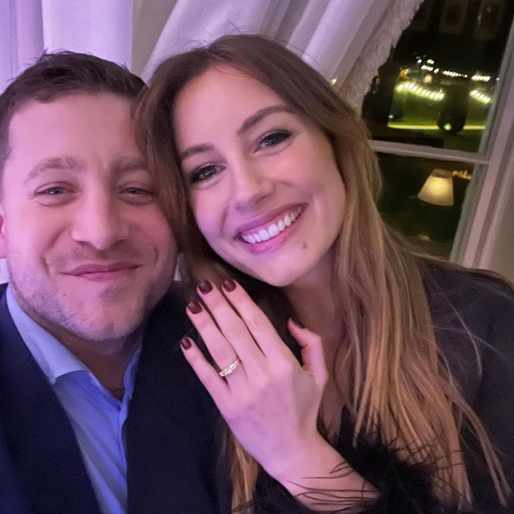 Faye Harris holds up her diamond engagement ring