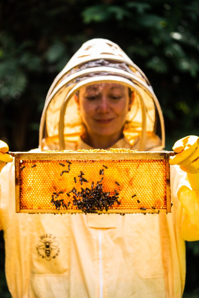 Woman with a bee hive