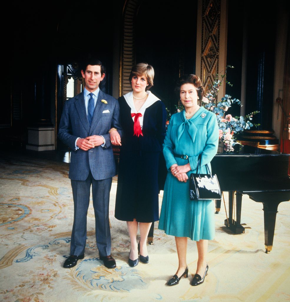  Diana wearing a nautical dress alongside the then Prince Charles and Queen Elizabeth in 1981