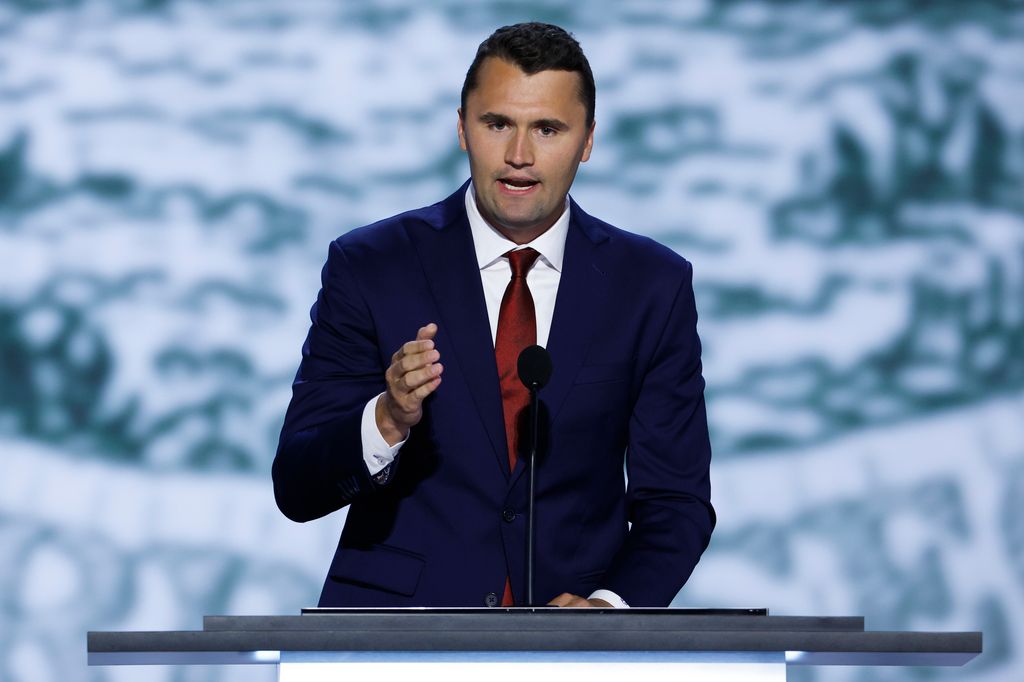 Charlie Kirk speaking on stage in 2024