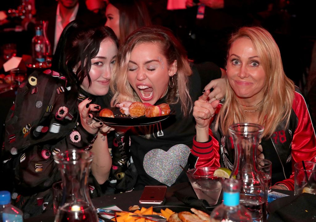 INGLEWOOD, CA - MARCH 05:  (L-R) Singers-songwriters Noah Cyrus and Miley Cyrus, and Tish Cyrus attend the 2017 iHeartRadio Music Awards which broadcast live on Turner's TBS, TNT, and truTV at The Forum on March 5, 2017 in Inglewood, California.  (Photo by Christopher Polk/Getty Images for iHeartMedia)