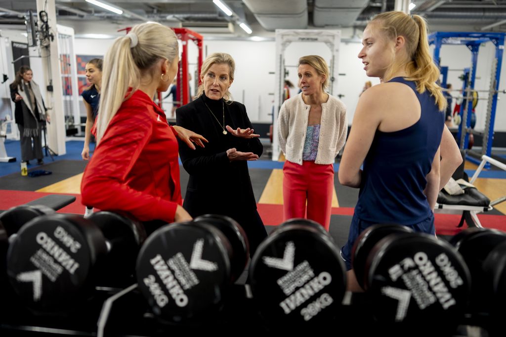 Sophie talks with team members during a gym session at a visit to England Hockey