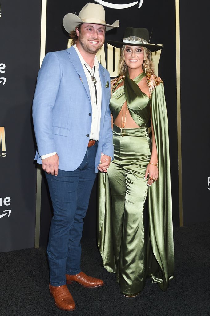 Lainey Wilson in a green jumpsuit with her boyfriend Devlin Hodges at the Academy of Country Music Awards 