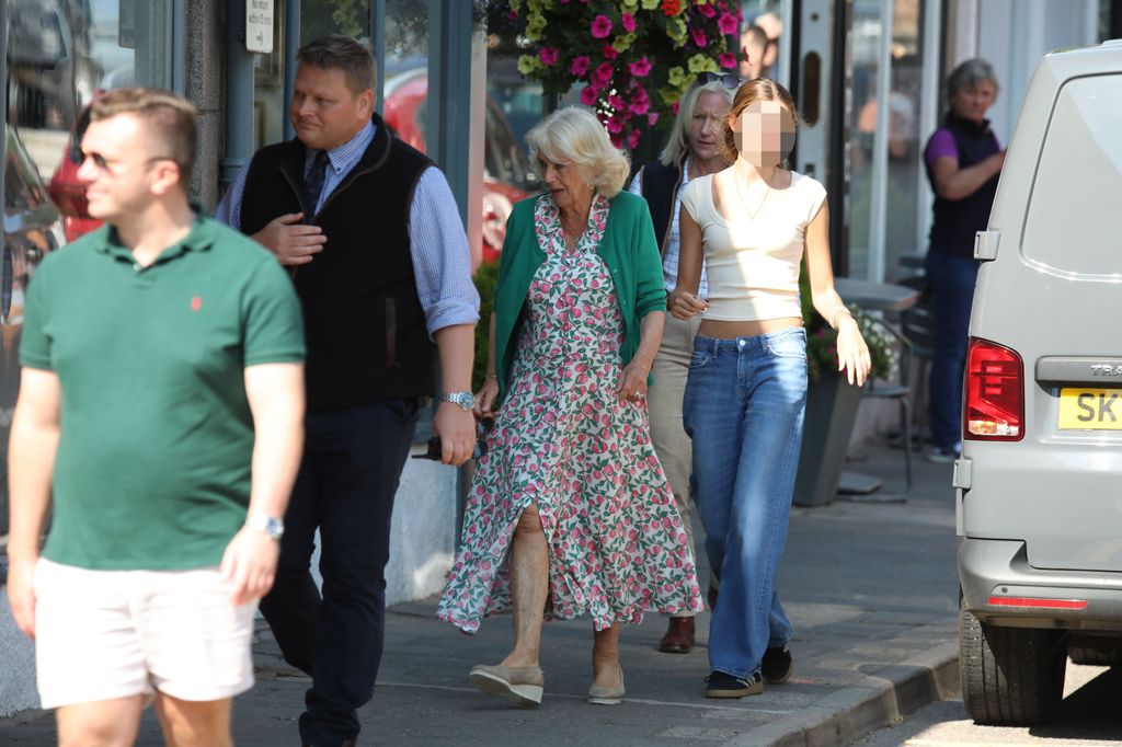 Queen Camilla in floral dress shopping with Eliza Lopes in Ballater