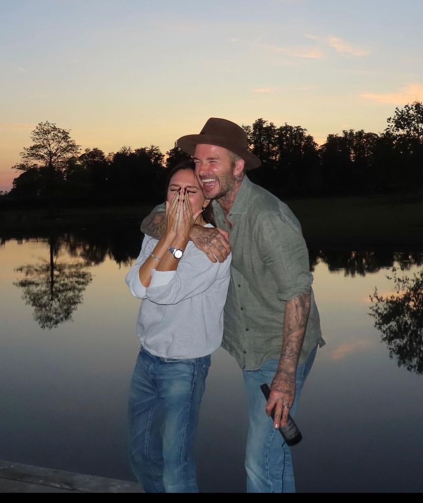 Victoria and David Beckham pose against a waterside backdrop