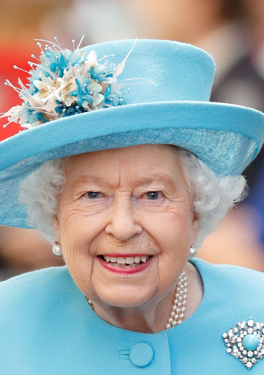 Queen Elizabeth II wearing a blue coat dress 