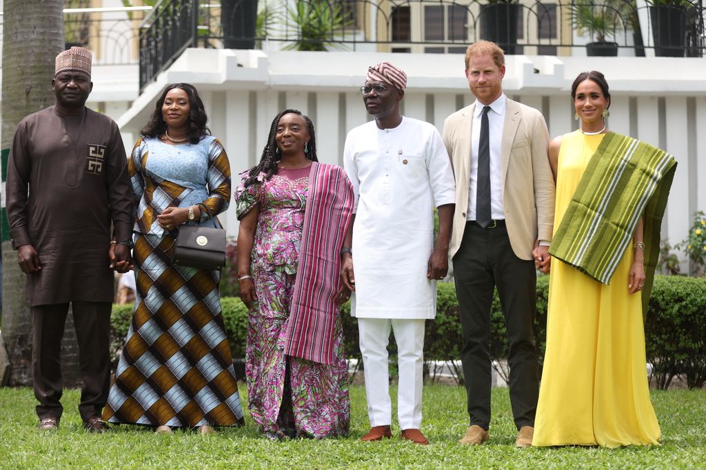 Nigeria Chief of Defense Staff Christopher Musa (L), his wife Lilian Musa (2ndL), Lagos State Governor wife, Ibijoke Sanwo-Olu (3rdL), Lagos State Governor, Babajide Sanwo-Olu (3ndR), Britain's Prince Harry (2ndR), Duke of Sussex, and Britain's Meghan (R), Duchess of Sussex, 