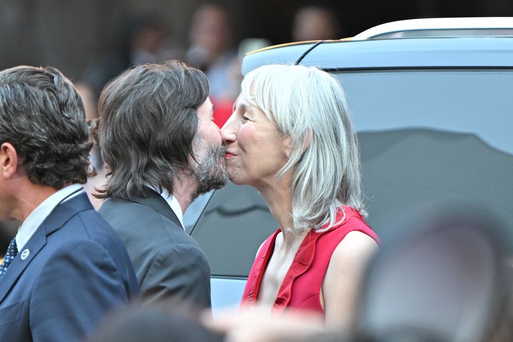 Keanu Reeves and partner Alexandra Grant kiss