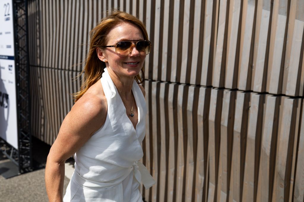 geri wearing white jumpsuit and sunglasses 