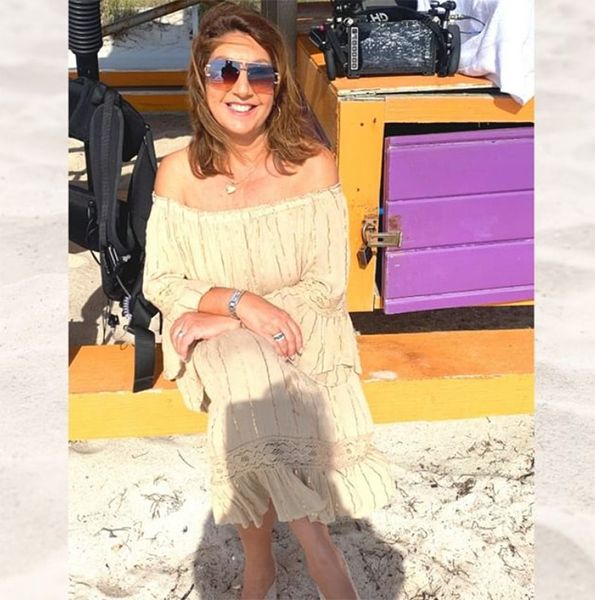 Jane McDonald in a dress on the beach