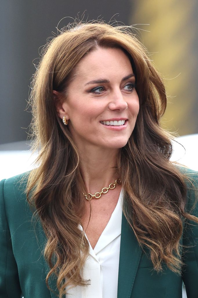 Kate Middleton with bouncy hair and gold pearl earrings at AW Hainsworth