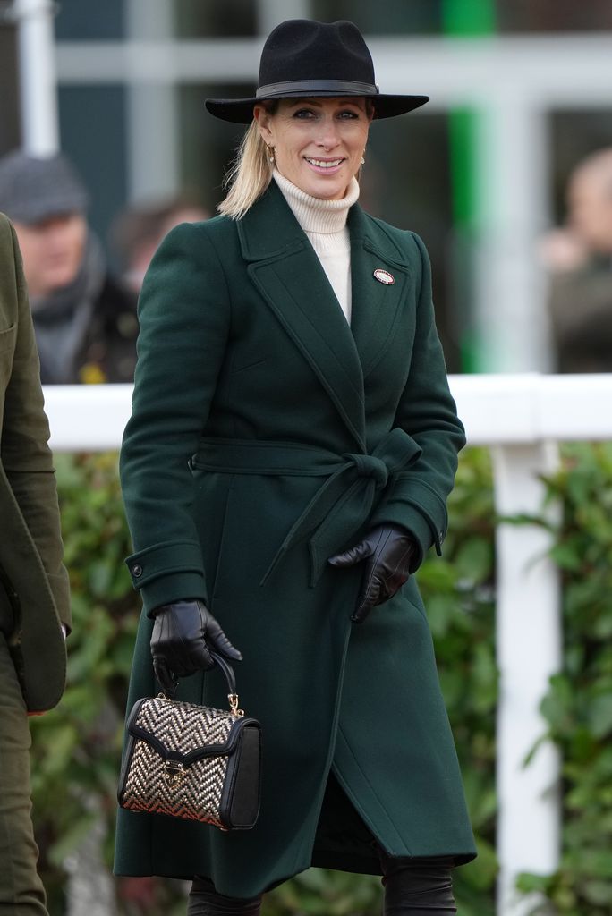 Zara Tindall in green coat and black fedora