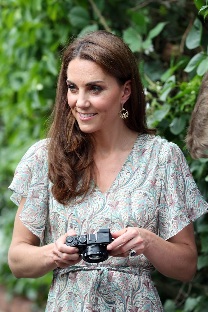 Princess Kate holding a camera