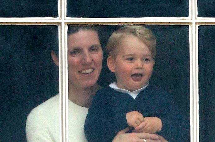 Prince George of Cambridge being held up at a window of Buckingham Palace by his nanny Maria Teresa Turrion Borrallo