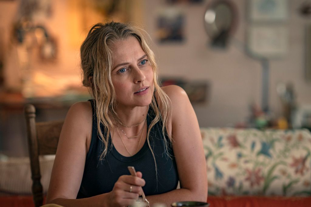 close-up of blonde woman at kitchen table 