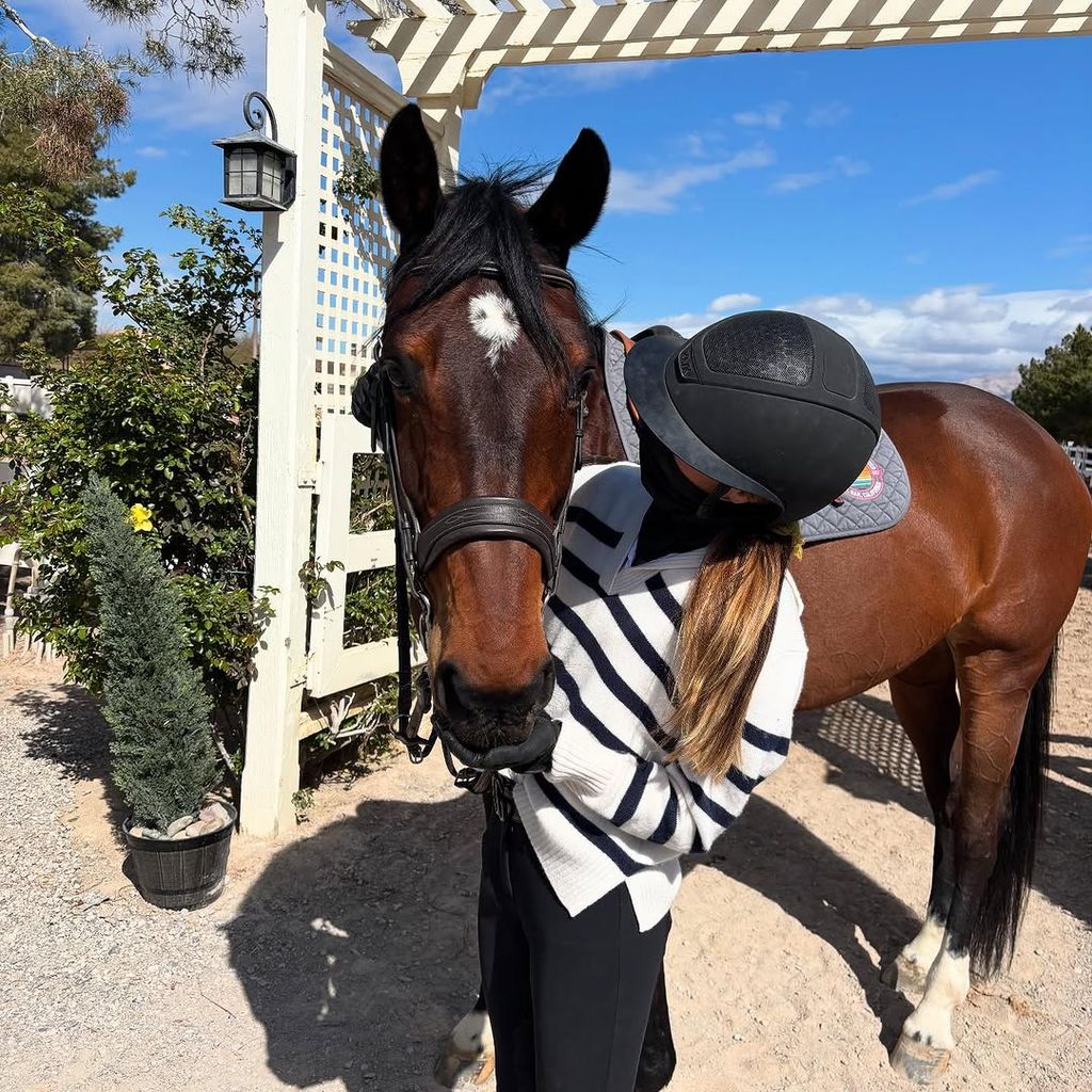 Grace Wahlberg tends to one of her horses in a photo shared on Instagram