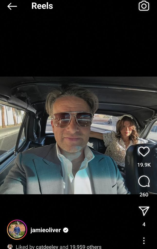 couple taking selfie in vintage car
