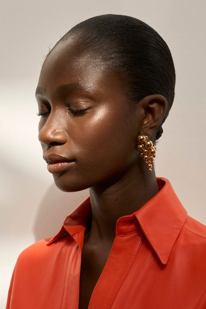 A model poses backstage at the Zimmermann S24 show