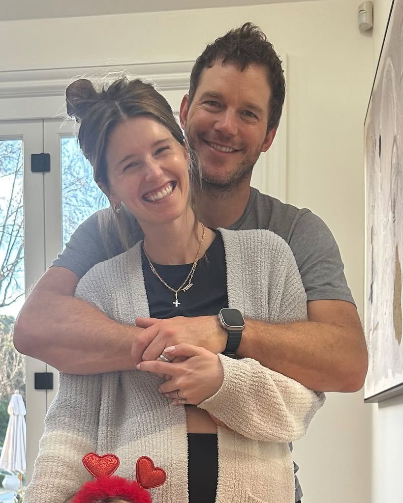 Chris Pratt puts his arms around wife Katherine Schwarzenegger as they pose for photo