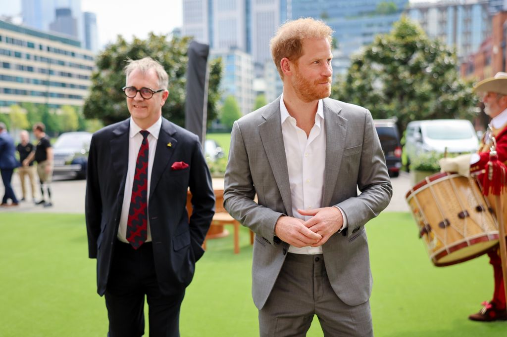 Prince Harry walking with Dominic Reid