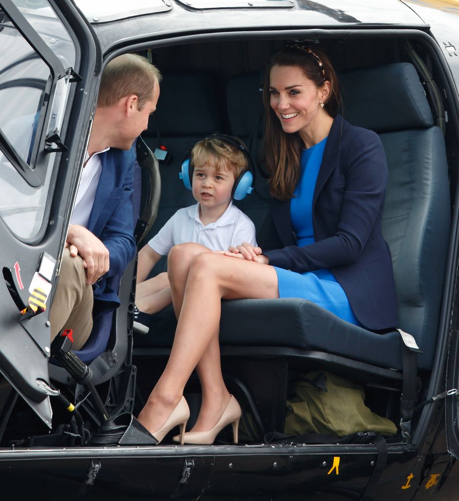 Prince George sitting in a helicopter with William and Kate in 2016