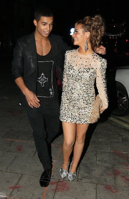 Lucien and Chelsee Healey walk arm in arm