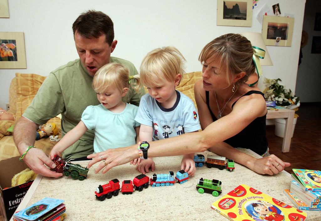 Gerry and Kate McCann playing with their twin children