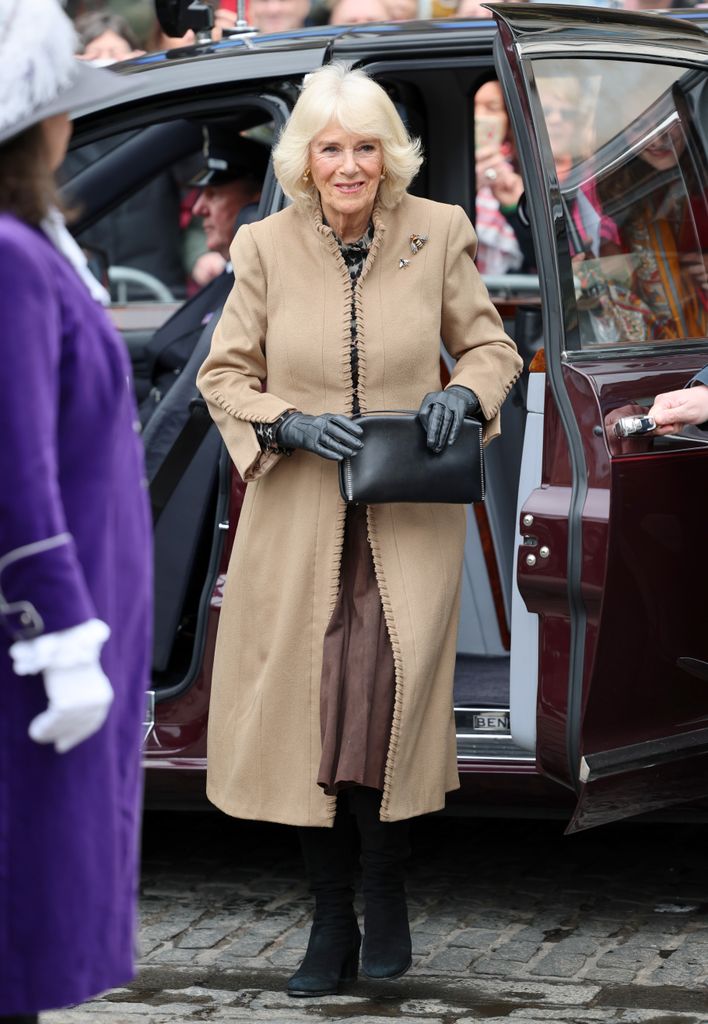The Queen looked pristine in a suede Anna Valentine coat and Russell & Bromley boots