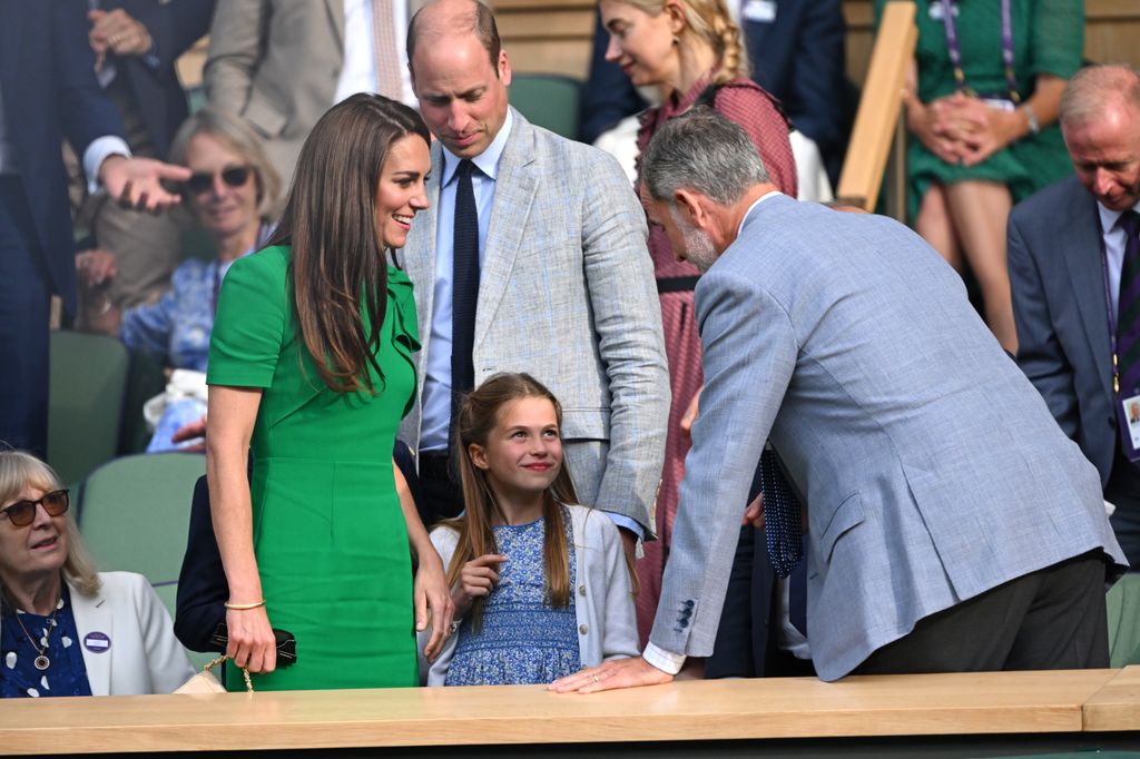 The Princess of Wales looking as charlotte talks to king felipe