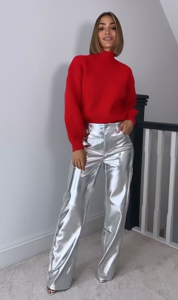 Frankie Bridge wears Bershka silver trousers with a red knit